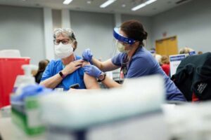 Historic, hopeful moment arrives as COVID-19 vaccinations begin on Medical Campus