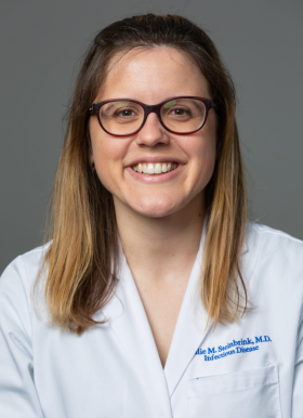 Profile picture of Dr. Julie M. Steinbrink in while lab coat