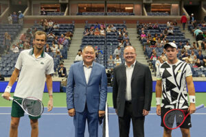 Bernard Camins, MD, MSCR, former faculty member, participates in the coin toss for the men’s singles match on Pride Day at the 2021 US Open